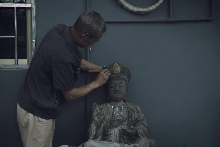 Man Sculpting A Statue